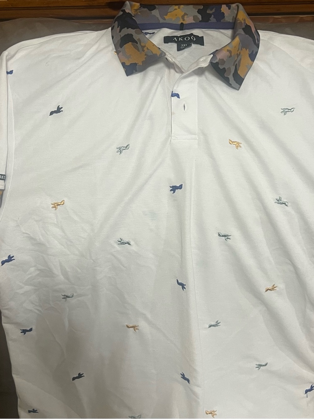 Akoo White Polo with Multicolor Micro-Embroidered Motifs and Camo Collar